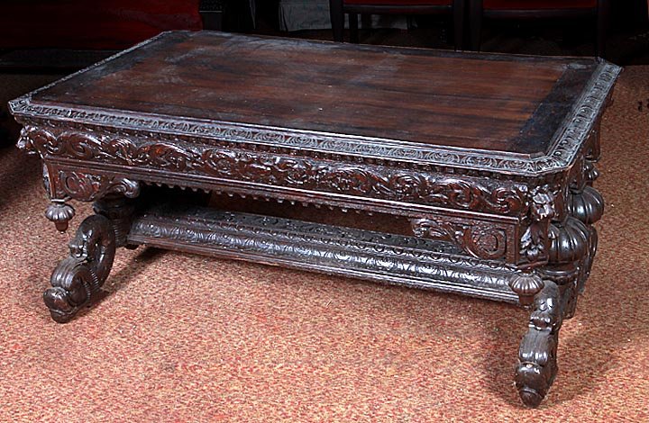 Oak center table w/carved lions, dolphins, and birds. N