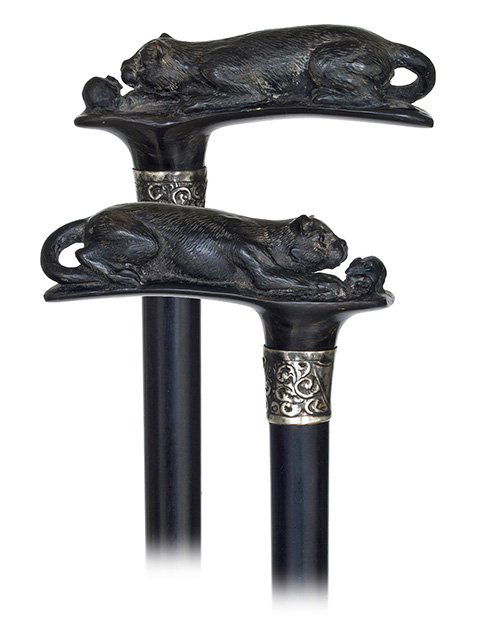 13. Horn Cat and Mouse Cane-Early 1900s-Horizontal blac: 13. Horn Cat and Mouse Cane-Early 1900s-Horizontal black horn handle carved with a cat and a mouse, chased silver collar, glass eyes ebony shaft and a horn ferrule. -H. 4 ¼” x 36 ¾”, O.L. 37”-