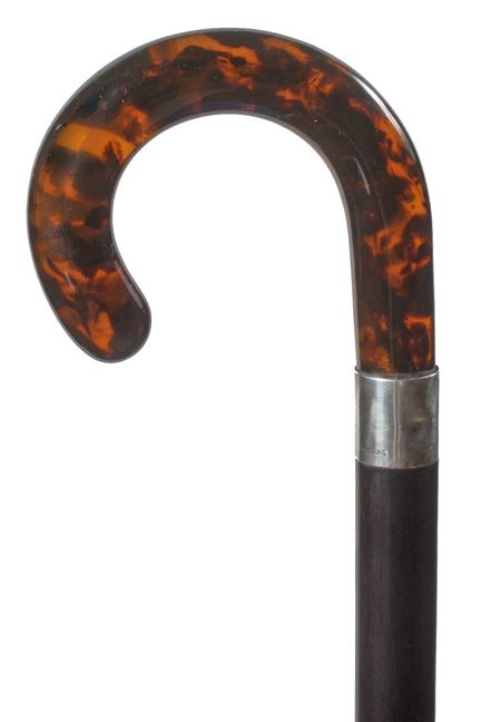 31. Faux Tortoise Dress Cane-Ca. 1935-A molded crook ha: 31. Faux Tortoise Dress Cane-Ca. 1935-A molded crook handle, signed sterling collar, ebony shaft and a horn ferrule-H. 4 ½” x 3 ½”, O.L. 34”-