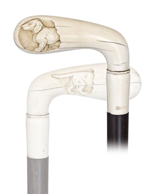 141. Ivory Dachshund Cane-19th Century-Ivory Sunday gol: 141. Ivory Dachshund Cane-19th Century-Ivory Sunday golfer with a dachshund front part on one side and his back part on the other to give the impression that the canine goes through the handle. Ebony