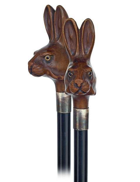110. Rabbit Dandy Cane-Ca. 1900-Boxwood rabbit head wit: 110. Rabbit Dandy Cane-Ca. 1900-Boxwood rabbit head with upright ears and glass eyes handle, ebony shaft with a plain silver collar and a metal ferrule. Mascot cane and with an appealing, whimsical to