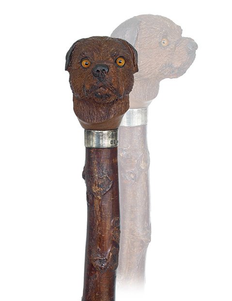 164. Dog Head Day Cane-Ca. 1920-Hardwood dog head knob : 164. Dog Head Day Cane-Ca. 1920-Hardwood dog head knob with a well figured hairy coat and inset glass eyes, wild cherry branch with a horn ferrule and a plain silver collar with Birmingham hallmarks.-