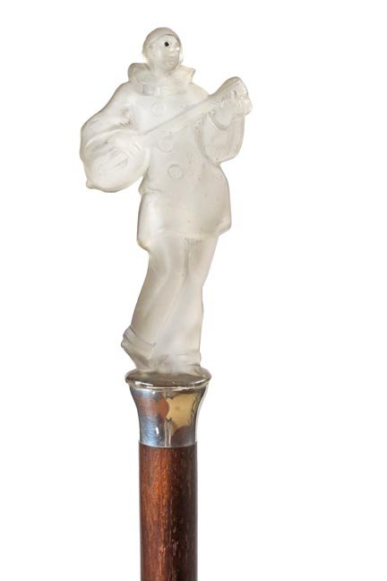 168. Art Deco Glass Cane-Ca. 1920-A satin glass clown p: 168. Art Deco Glass Cane-Ca. 1920-A satin glass clown playing a banjo which has been attached to a silver handle, back of the clown acts as a thumb rest, hardwood shaft and a metal ferrule, probably a