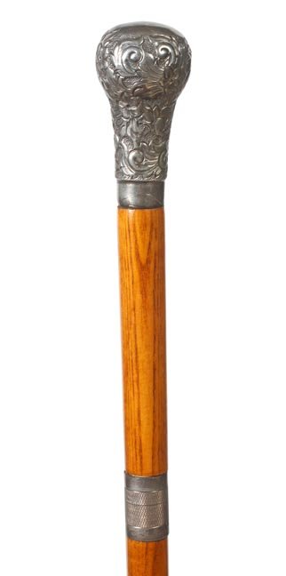 171. Sword Dress Cane-Early 20th Century-An ornate silv: 171. Sword Dress Cane-Early 20th Century-An ornate silver metal hallmarked handle, 20” 6-sided pike blade with screwing mechanism, oak shaft and an ebony ferrule-H. 3 ½” x 2”, O.L. 38”-