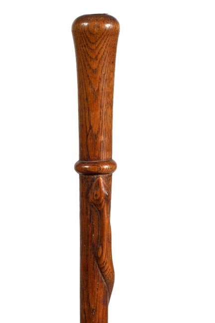232. Folk Art Snake Cane-Ca. 1890-A one piece carved oa: 232. Folk Art Snake Cane-Ca. 1890-A one piece carved oak shaft with a full length snake, federal shield, and a brass ferrule-O.L. 33”-