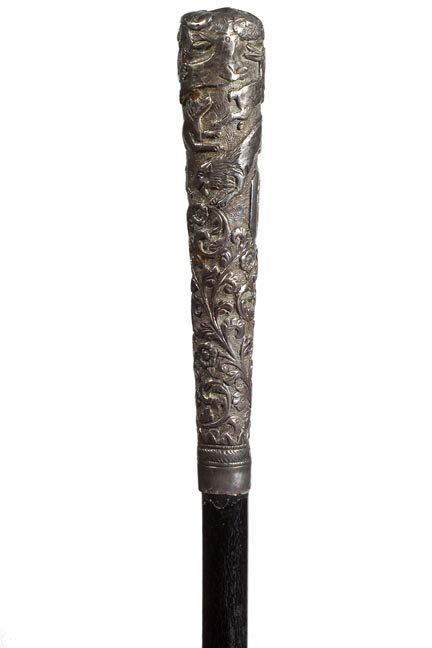 238. Asian Silver Dress Cane-Ca. 1890-A silver metal ha: 238. Asian Silver Dress Cane-Ca. 1890-A silver metal handle with various animals and foliage cast, small silver metal collar, ebony shaft and a brass ferrule-H. 6” x 1”, O.L. 33 ½”-