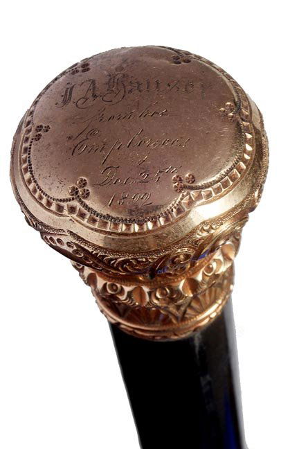 245. Gold-Filled Dress Cane-Dated 1892-A nice presentat: 245. Gold-Filled Dress Cane-Dated 1892-A nice presentation by the Simons Co., ebony shaft and a metal ferrule-H. 1 ¾” x 2”, O.L. 36”-