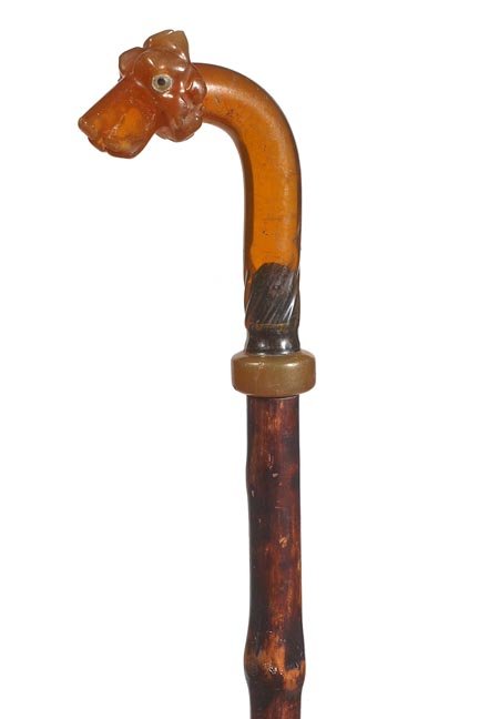 256. Lucite Dog Cane-Ca. 1940-A well formed dog with tw: 256. Lucite Dog Cane-Ca. 1940-A well formed dog with two color glass eyes, large horn collar, bamboo shaft and no ferrule-H. 3” x 4”, O.L. 33 ¾”-