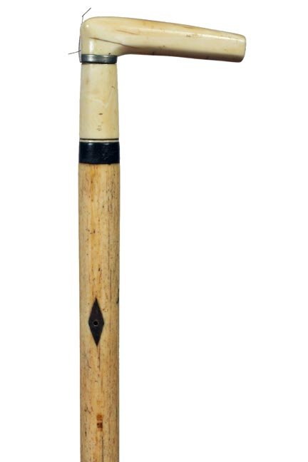 11. Nautical Whalebone Cane-Ca. 1860-Whale’s tooth: 11. Nautical Whalebone Cane-Ca. 1860-Whale’s tooth handle with a small silver metal spacer, baleen collar, extremely smooth 7/8” bone shaft with one baleen diamond inlaid and a brass ferrule-H. 3