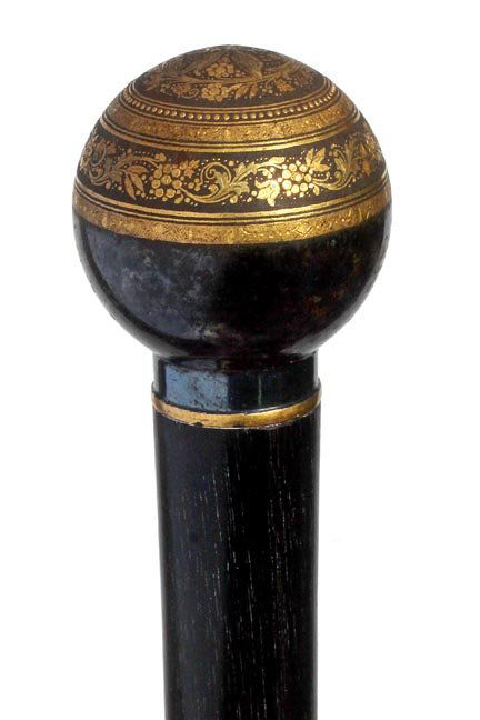 40. Toledo Dress Cane-Ca. 1910-Nice damascene work: 40. Toledo Dress Cane-Ca. 1910-Nice damascene work throughout in fine condition, small gold metal collar, thick ebony shaft and a horn ferrule-H. 1 ¾” x 2”, O.L. 36”