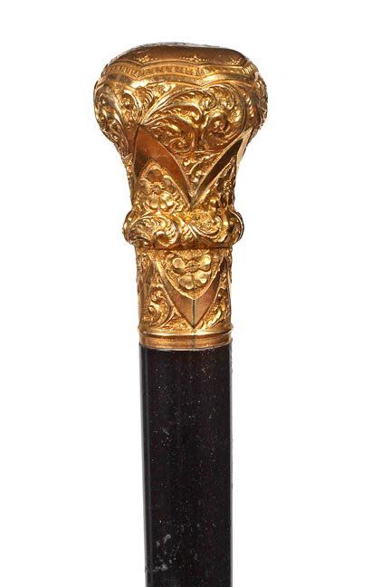 86. Gold-filled Dress Cane-Ca. 1890-A presentation: 86. Gold-filled Dress Cane-Ca. 1890-A presentation handle with dents atop, ebony shaft and a metal ferrule-H. 1 ½” x 2 ¾”, O.L. 36”