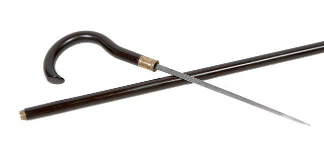 129. Sword Cane-Ca. 1885-A Gutta Percha handle and: 129. Sword Cane-Ca. 1885-A Gutta Percha handle and shaft, brass collar, 8” engraved blade and a very unusual brass and metal ferrule-O.L. 35”