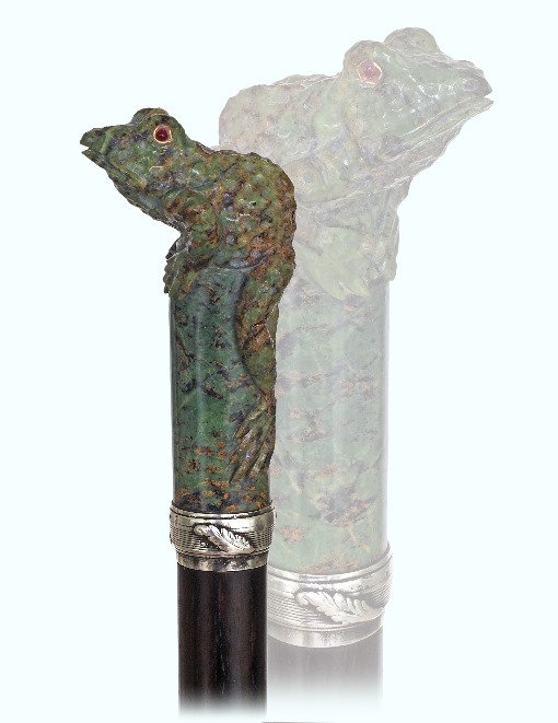 4. Jade Figural Cane-Late 19th, early 20th: 4. Jade Figural Cane-Late 19th, early 20th Century-Large mottled jade frog on a plinth handle, ruby cabochon eyes in gold framing, silver collar, rosewood shaft and a horn ferrule. This cane is in the