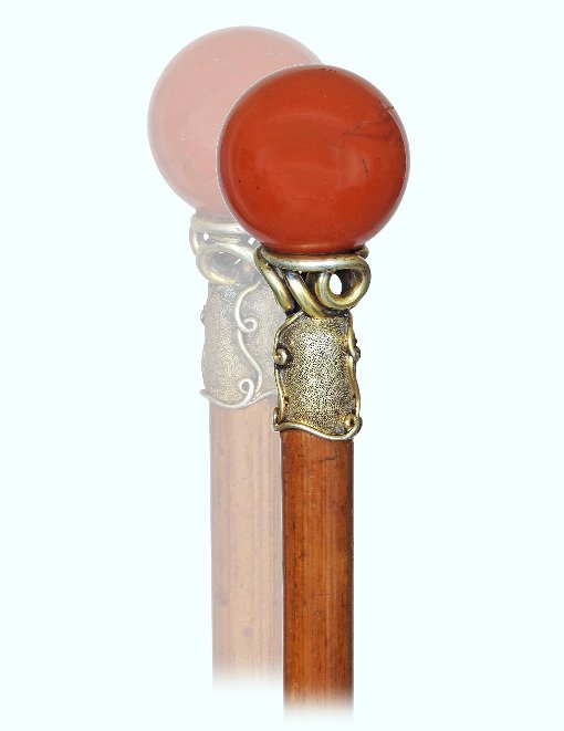 19. Hard Stone Dress Cane-Ca. 1900-Intense red Jasper: 19. Hard Stone Dress Cane-Ca. 1900-Intense red Jasper ball knob on its elaborated silver gilt collar, malacca shaft and a long horn ferrule. French-H. 2 ½” x 1 ¼”, O.L. 29”-