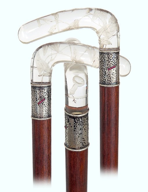 84. Jeweled Rock Crystal Cane-Ca. 1900-L-shaped rock: 84. Jeweled Rock Crystal Cane-Ca. 1900-L-shaped rock crystal handle delicately engraved with a flowering twig, hammered silver collar with four facetted rubies on each side, rosewood shaft and a horn 