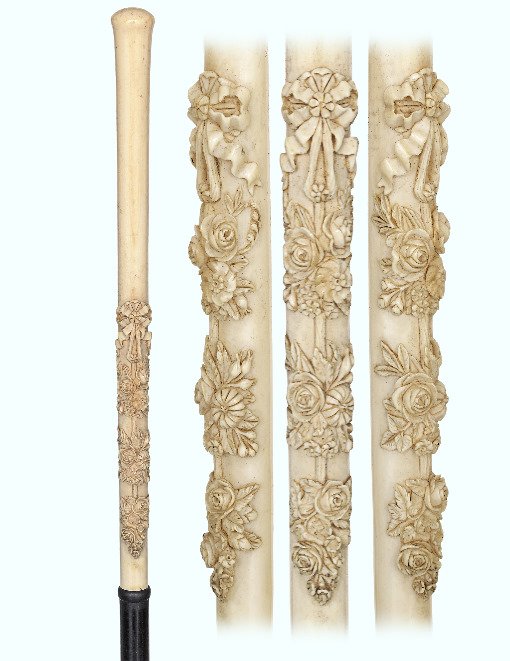 135. Ivory Dress Cane-Ca. 1870-Long and straight turned: 135. Ivory Dress Cane-Ca. 1870-Long and straight turned ivory handle carved in high relief and extreme precision with a flower composition. Ebony shaft and a horn ferrule. Best French quality from the
