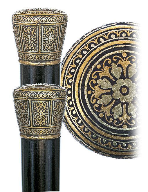 152. Toledo Dress Cane-Spain, circa 1885-A remarkable: 152. Toledo Dress Cane-Spain, circa 1885-A remarkable Toledo steel knob with dense 24 karat yellow gold and silver wire Damascene work with arabesque and trellises within multiple frames, ebony shaft