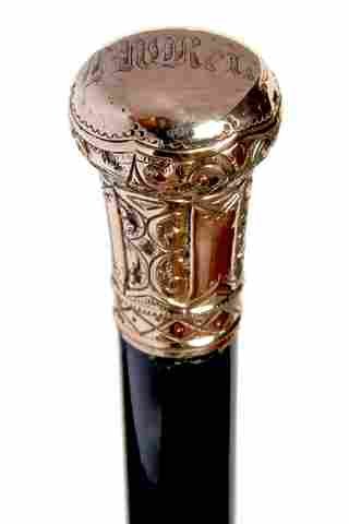 Gold Dress Cane-Ca. 1900: Gold Dress Cane-Ca. 1900-A nice gold filled presentation with high relief work, ebony shaft and a metal ferrule-H. 1 ¼” x 2”, O.L. 35”
