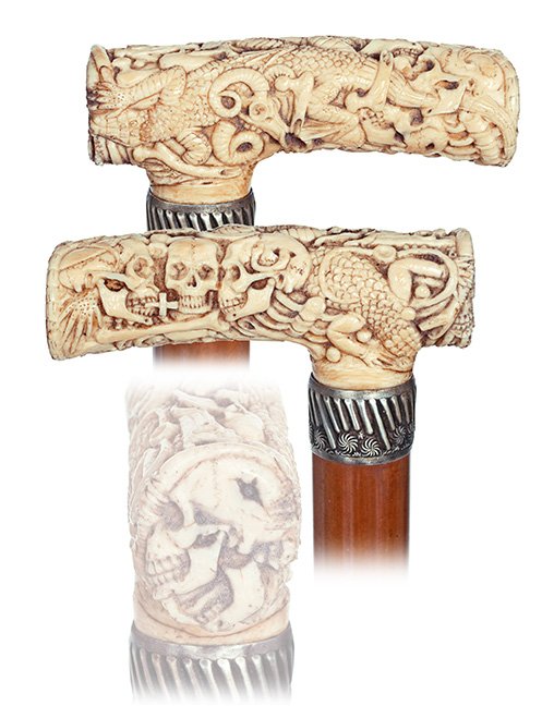 55. Memento Mori Ivory Cane-19th Century-Opera shaped: 55. Memento Mori Ivory Cane-19th Century-Opera shaped ivory handle throughout carved with human and animal skulls as well as skeleton bones, lizards and snakes. Malacca shaft with a metal collar and a