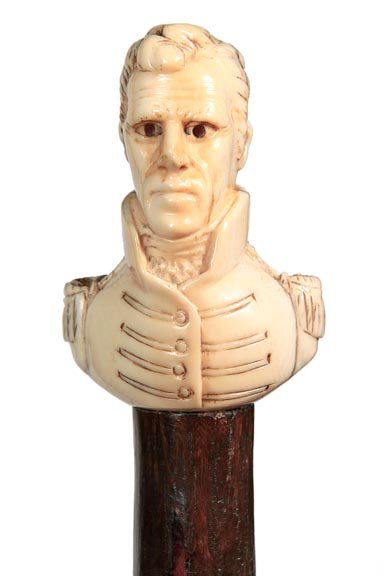 80. Andrew Jackson Ivory Cane-Mid 19th Century-An: 80. Andrew Jackson Ivory Cane-Mid 19th Century-An unusual carving of the Tennessean president “Old Hickory” himself in his uniform, hickory twigspur shaft with ivory attachments on the spurs, 3”