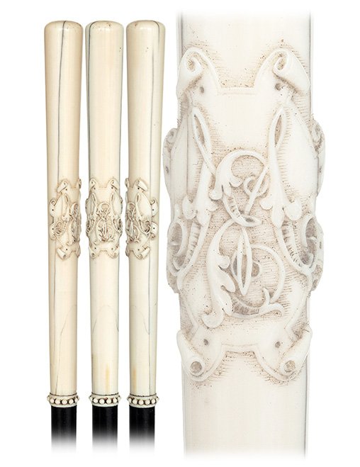 110. Ivory Dieppe Cane-19th Century-Long and tapering: 110. Ivory Dieppe Cane-19th Century-Long and tapering ivory handle carved in relief with an elaborate shield and intricate “M E” initials, ebony shaft with a beaded ivory collar and an ebony ferru