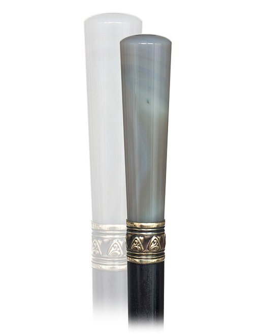 118. Agate Dress Cane-Early 20th Century-The polished: 118. Agate Dress Cane-Early 20th Century-The polished Milord handle of a natural gray color and subtle foggy structure, ebony shaft with a yellow metal collar and a horn ferrule.-H. 3 ½” x 1”, O.