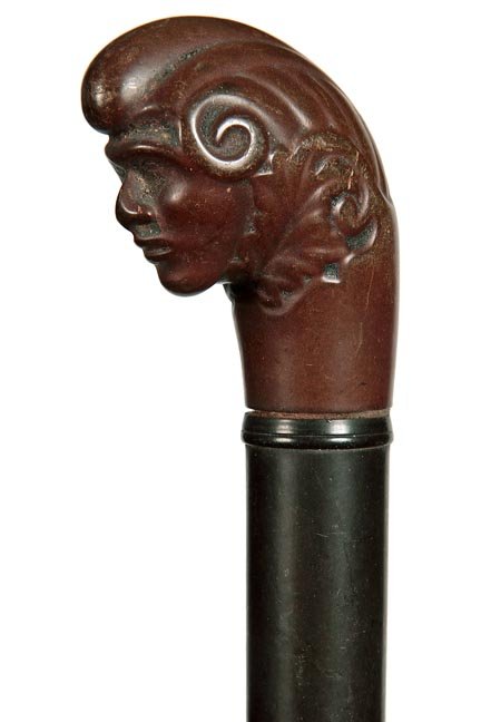 165. Gutta Percha Dress Cane-Ca. 1875-A mythological: 165. Gutta Percha Dress Cane-Ca. 1875-A mythological figure handle, ebony shaft and a 4” iron ferrule-H. 2 ¼” x 2 ½”, O.L. 33 ½”- 200-400