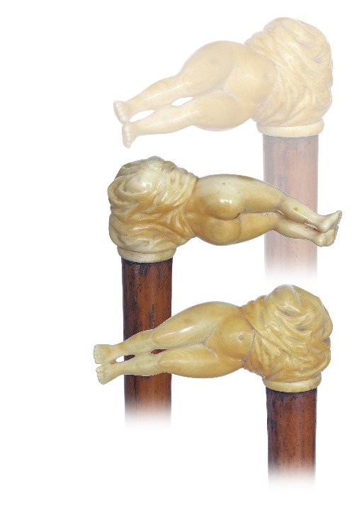 31. Ivory Erotic Cane -Ca. 1890-Large ivory handle: 31. Ivory Erotic Cane -Ca. 1890-Large ivory handle showing a reclining nude woman with the head and chest covered by a wrinkled bed sheet, malacca shaft and a brass ferrule. A flawless, smooth and sun