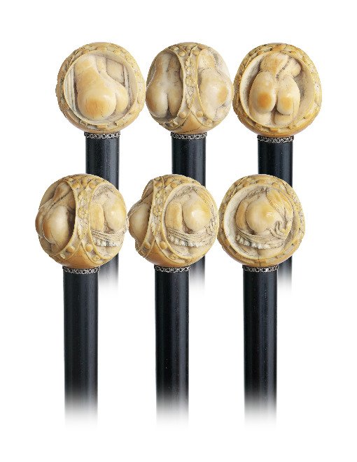 32. British Buttock Erotic Cane-Ca. 1890-Erotic ivory: 32. British Buttock Erotic Cane-Ca. 1890-Erotic ivory ball knob handle with delicate carving in incredible miniature detail, ebony shaft with a slim silver ring filigree collar and a long stag horn fe