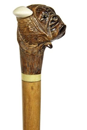 85. Bulldog Glove Holder Cane-Ca. 1895-A carved wooden: 85. Bulldog Glove Holder Cane-Ca. 1895-A carved wooden bulldog with two color glass eyes, ivory ears, lever mechanism under chin which opens the mouth, ivory collar, hardwood shaft and a horn ferrule-