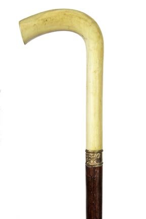 115. Ivory Dress Cane-Ca. 1900-A nice ivory day cane,: 115. Ivory Dress Cane-Ca. 1900-A nice ivory day cane, ornate gold filled collar, stained malacca shaft and a metal ferrule-H. 3 ¼” x 5”, O.L. 33 ½”