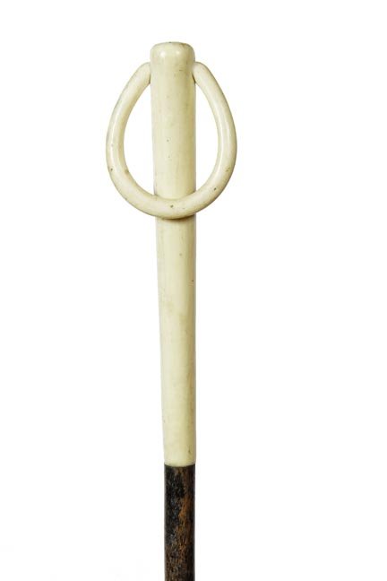 141. Ivory Glove Holder Cane-Ca. 1910-A nice example of: 141. Ivory Glove Holder Cane-Ca. 1910-A nice example of this type of cane with an ivory handle and ring, exotic wood shaft and a brass ferrule-H. 5 ½” x 1 ¾”, O.L. 35 ½’