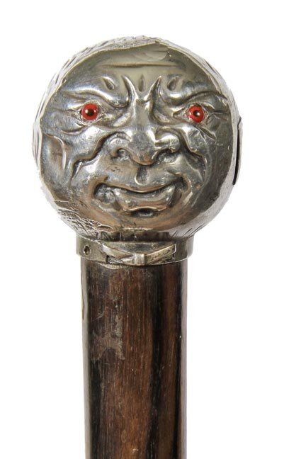 165. Vesta Match Safe Cane-Ca. 1880-A coin silver: 165. Vesta Match Safe Cane-Ca. 1880-A coin silver unique gentleman’s head with two color glass eyes, spring loaded side compartment for matches and a striker on the interior on the door, bow tie col