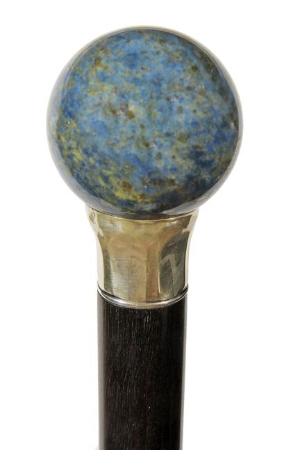 185. Blue Hardstone Dress Cane-Ca. 1930-A blue: 185. Blue Hardstone Dress Cane-Ca. 1930-A blue hardstone sphere which is probably lapis, fluted unmarked sterling collar, ebony shaft and a metal ferrule-H. 1 ¾’ x 1 ¾”, O.L. 36”
