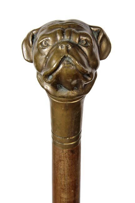 207. Bulldog Defensive Cane-Ca. 1930-A bell bronze: 207. Bulldog Defensive Cane-Ca. 1930-A bell bronze weighted bulldog handle, bell bronze collar, hardwood shaft and a brass ferrule-H. 1 ¾” x 1 ½”, O.L. 36”