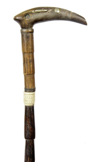218. Horn Sword Cane-Ca. 1885-A horn handle with two of: 218. Horn Sword Cane-Ca. 1885-A horn handle with two of three silver metal attachments, carved bone collar, 14” push and pull three sided blade and a bone ferrule-H. 4 ½” x 2”, O.L. 35”