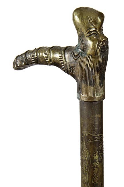 Chinese brass cane: Chinese brass cane, circa 1930, a full brass handle and shaft with Chinese characters throughout the bottom half of the cane, a wood ferrule with a cork interior which has secret compartment. Handle i