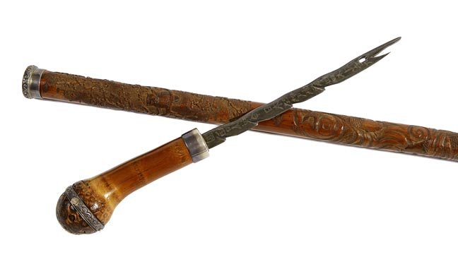 127. Watch and Sword Cane- Ca. 1900-An unusual dual: 127. Watch and Sword Cane- Ca. 1900-An unusual dual purpose cane with a silver pocket watch atop hidden by a pushbutton mechanism, a 7 ½” hand worked blade with Asian characters, silver metal coll