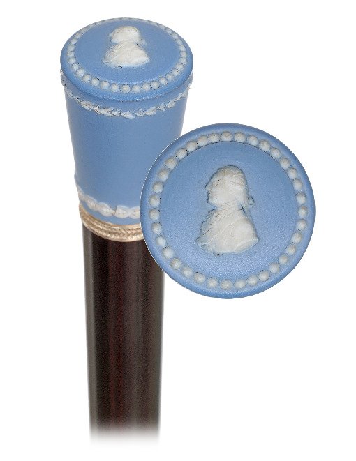 94. Wedgwood Porcelain Dress Cane-Ca. 1900-Milord pale: 94. Wedgwood Porcelain Dress Cane-Ca. 1900-Milord pale blue and white unglazed Wedgwood Jasperware knob, silver trailing laurel leaf band collar, ebonized hardwood shaft and a horn ferrule. Very seldo