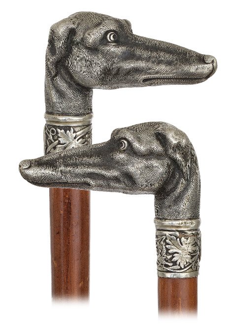 117. Figural Silver Day Cane-Ca. 1890-Silver handle: 117. Figural Silver Day Cane-Ca. 1890-Silver handle well modeled and finely hand chased to depict a greyhound head with a well fired hairy coat, malacca shaft with an expertly done repair near the bot
