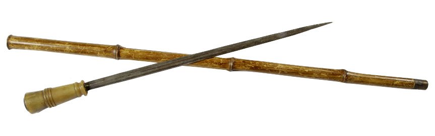Sword Cane- Circa 1850, buffalo horn handle, 19 1/2" x: Sword Cane- Circa 1850, buffalo horn handle, 19 1/2" x 3/4" blade, large bamboo shaft and a metal ferrule, H. 4 1/2" x 1 3/4", O.L. 37"