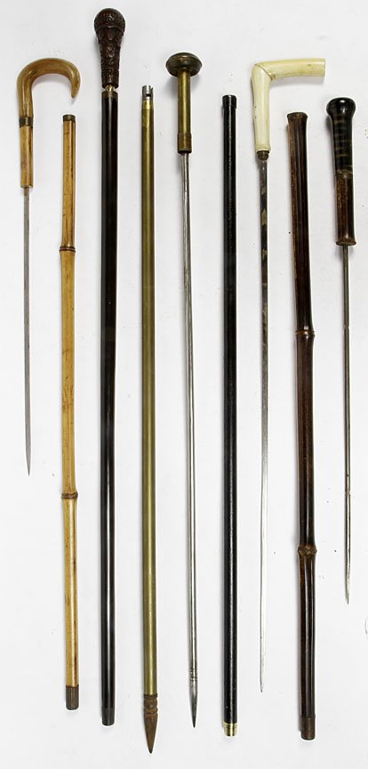 Sword Canes-Circa 1840-1865. Group of good canes, 2: Sword Canes-Circa 1840-1865. Group of good canes, 2 horn, I ivory, 1 bone etc, ivory snake has push button mechanism