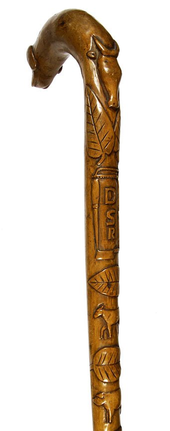 Folk Art Butchers Cane-Circa 1900-Carved one piece: Folk Art Butchers Cane-Circa 1900-Carved one piece cane, steer head, butchers saw-cleaver, steele knife, pigs-sheep and other animals, no ferrule and original finish, O.L. 33 1/2"