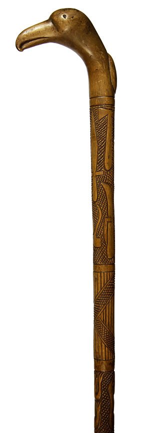 Folk Art Cane-Circa 1890- A wonderful carving of: Folk Art Cane-Circa 1890- A wonderful carving of rifles, pistols, pipes, dogs, pocket knives, whiskey jugs and maybe a stylized CSA flag, original finish in high relief, carved top to bottom and no fe