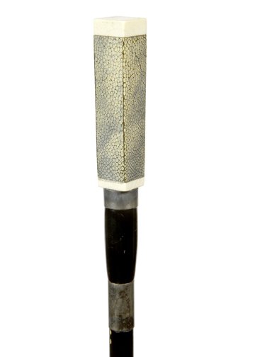 105. Art Deco Ivory Dress Sword Cane- Pre-Ban-A carved: 105. Art Deco Ivory Dress Sword Cane- Pre-Ban-A carved ivory dress cane with a shagreen covering, ivory is signed Swaine & Adeney London, two silver metal collars, twin 1” four sided blade which