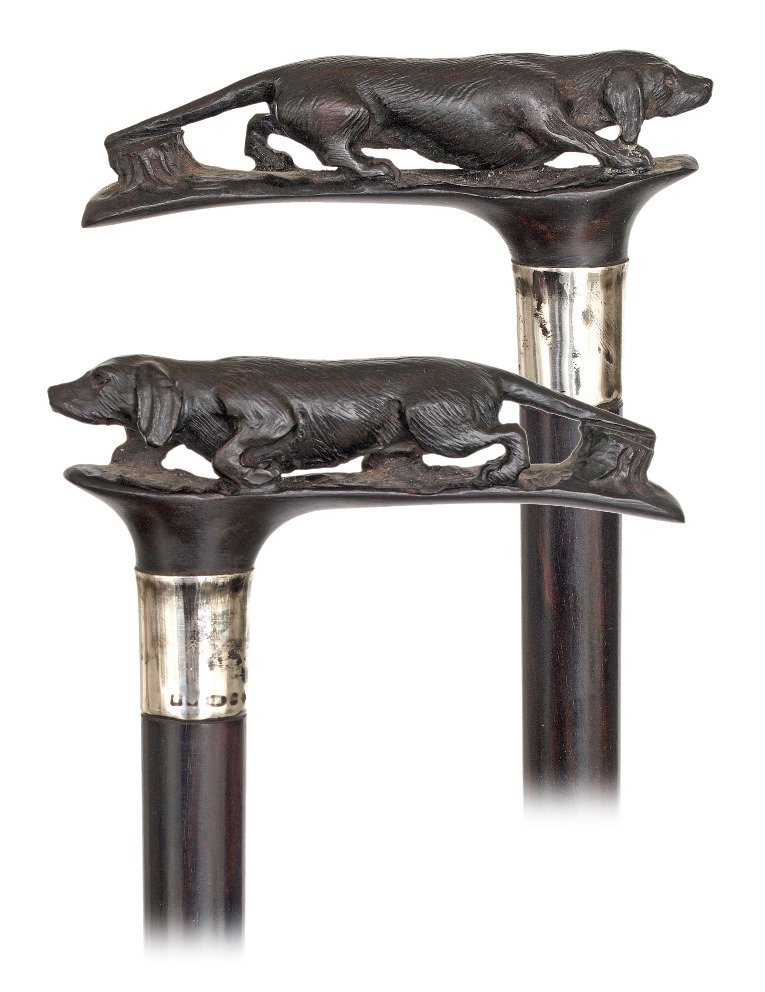 89. Horn Dog Cane -Early 1900s -Horizontal black horn: 89. Horn Dog Cane -Early 1900s -Horizontal black horn handle carved with a retriever in a set stance, ebony shaft with a horn ferrule and a plain Sterling silver collar with English hallmarks. The car