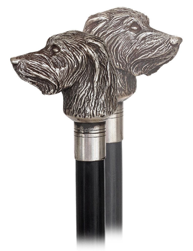 107. Silver Dog Cane-Ca. 1920-Cast silver long haired: 107. Silver Dog Cane-Ca. 1920-Cast silver long haired dog head with a long and plain silver collar, ebonized hardwood shaft and a brass ferrule. -H. 4” x 3 ¼”, O.L. 36”