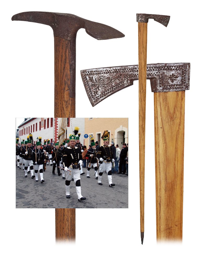 112. Two Miner “Steigerhäckchen” Axe Canes-Ca.: 112. Two Miner “Steigerhäckchen” Axe Canes-Ca. 1900-Saxon miner’s axe cane with an ax shaped steel handle decorated with trailing geometrical motifs, wide angular-oval and tapering oak shaft an