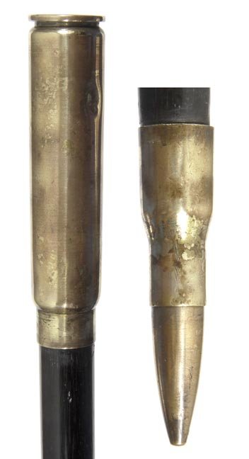 185. Trench Art Cane-Ca. 1940-A large brass artillery: 185. Trench Art Cane-Ca. 1940-A large brass artillery shell, thick ebonized shaft and a brass 3” bullet ferrule-H. 5” x 1 ½”, O.L. 38”