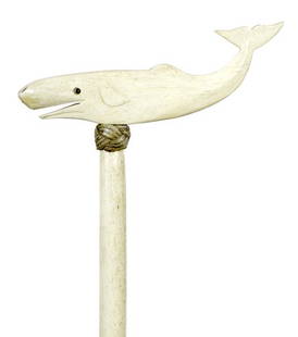 4. Whalebone Nautical Cane-Ca. 1870-A carved bone whale: 4. Whalebone Nautical Cane-Ca. 1870-A carved bone whale handle with two color glass eyes, nautical waxed knot collar, 7/8” diameter whalebone shaft and a small metal ferrule-H. 8 1/2” x 3”,
